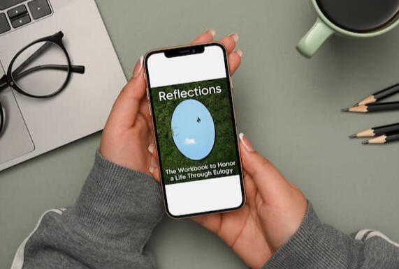 Woman looking at Reflections book on iPhone